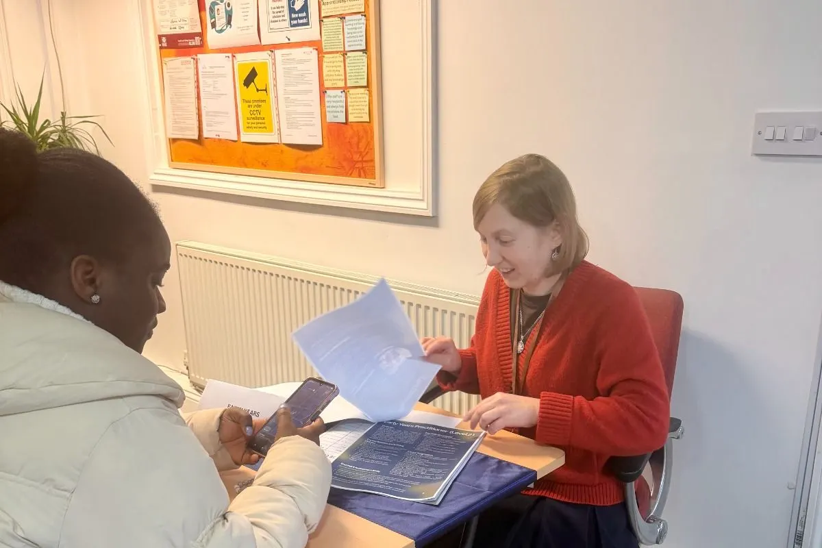 An adviser talking a candidate through their options at a one-to-one guidance session.