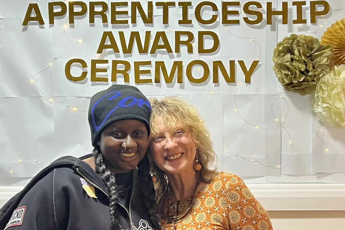 A learner and tutor smiling together at the Apprenticeship Award Ceremony.